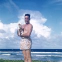 Kwaj-Dad-with-Cat-on-beach-in-those-shorts